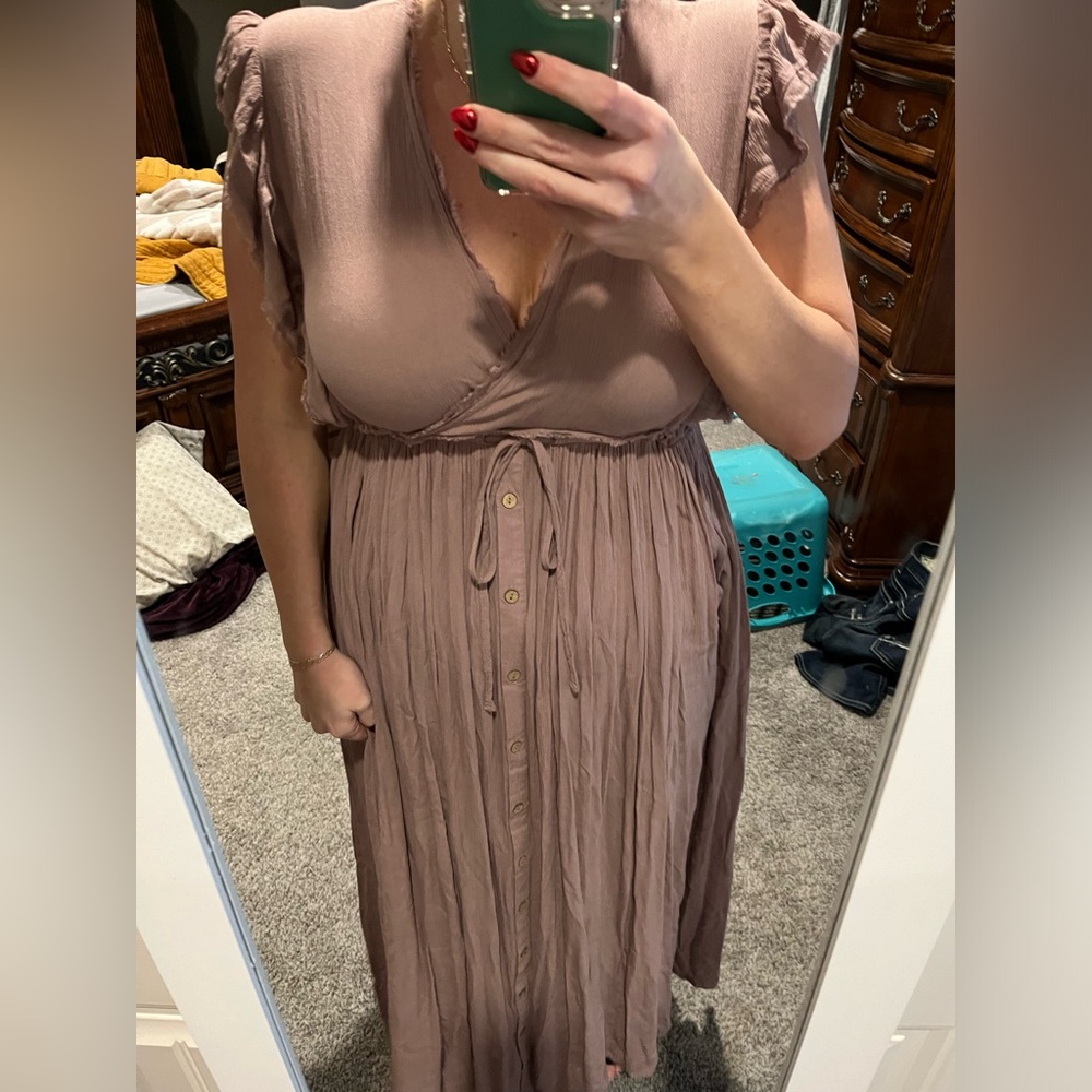 Mauve dress from boutique. Never worn just tried on. It ties at the bra line.